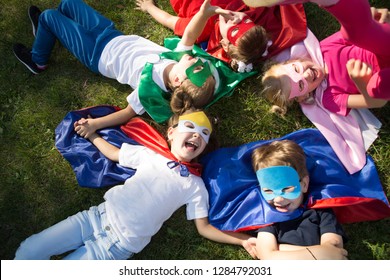 Group Kids Friends  Superhero Playing Togetherness And Having Fun Outdoor.
