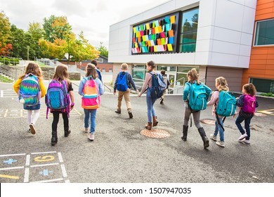 Group Of Kids Go To The School, Back View