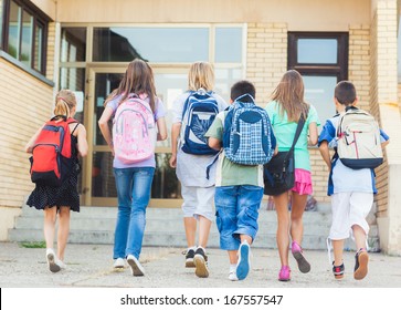 Group of kids going to school together. - Shutterstock ID 167557547