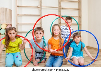 Group Of Kids Holding Hula Hoops