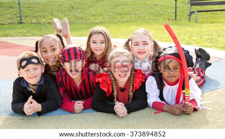 group of kids on halloween posing outside