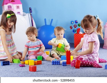 Group of kids playing with constructor