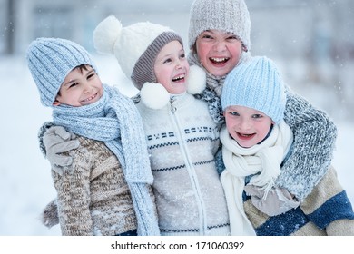 Group of kids playing in the snow in winter clear day