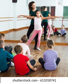 Group Of Kids With Teacher Dancing Ballet In Dance Class
Group Of Kids With Teacher Dancing Ballet In Dance Hall