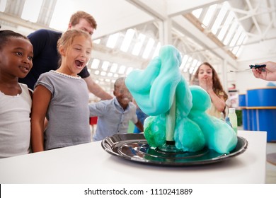 Group of kids and teachers carrying out a science experiment - Powered by Shutterstock