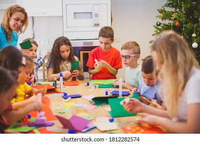 Group Of Kids And Teachers Making Greeting Cards