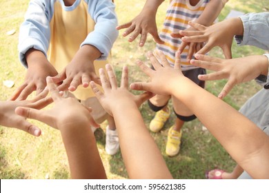 A Group Of Kids With Their Hands / Top View From Above. Selective Focus.