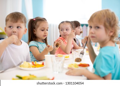 Group Of Kindergarten Children Have Lunch In Daycare