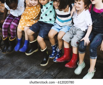 Group of kindergarten kids friends arm around sitting and smiling fun - Shutterstock ID 612020780