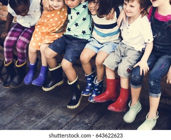 Group of kindergarten kids friends arm around sitting and smiling fun - Shutterstock ID 643622623