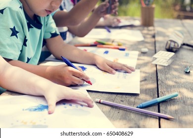 Group of kindergarten kids friends drawing art class outdoors - Powered by Shutterstock