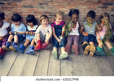 Group of kindergarten kids little farmers learning gardening - Shutterstock ID 620217998