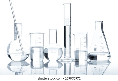 Group Of Laboratory Flasks With A Clear Liquid, Isolated