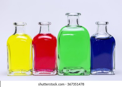group of laboratory flasks containing liquid color