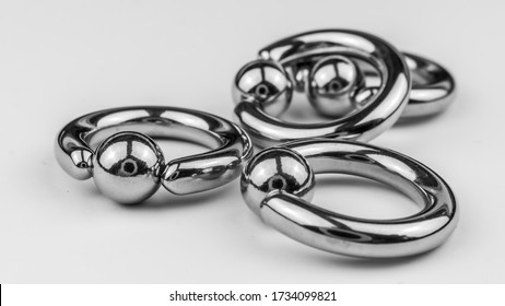 A group of large gauge surgical stainless steel body piercing rings