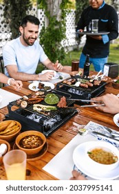 Group Of Latin Friends Eating Mexican Food In The Restaurant Terrace In Mexico Latin America