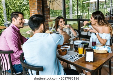 Group Of Latin Friends Eating Mexican Food In The Restaurant Terrace In Mexico Latin America