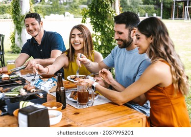 Group Of Latin Friends Eating Mexican Food In The Restaurant Terrace In Mexico Latin America