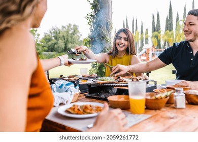 Group Of Latin Friends Eating Mexican Food In A Restaurant Terrace In Mexico Latin America