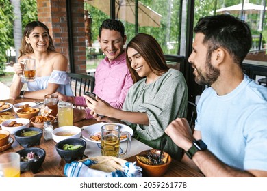 Group Of Latin Friends Eating Mexican Food In A Restaurant Terrace In Mexico Latin America