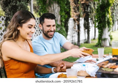 Group Of Latin Friends Eating Mexican Food In A Restaurant Terrace In Mexico Latin America