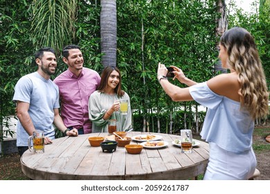 Group Of Latin Friends Eating Mexican Food In A Restaurant Terrace In Mexico Latin America