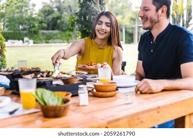 Group Of Latin Friends Eating Mexican Food In A Restaurant Terrace In Mexico Latin America