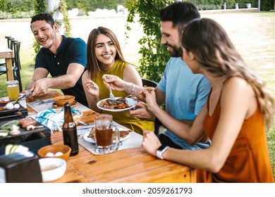 Group Of Latin Friends Eating Mexican Food In A Restaurant Terrace In Mexico Latin America