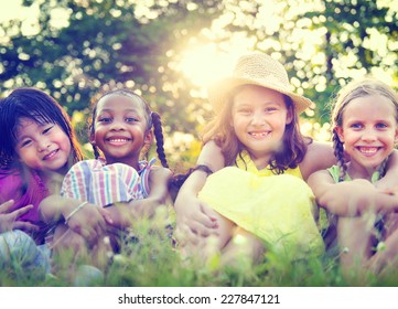 Group Of Little Girls Smiling Park Concept