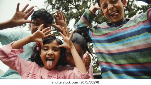 A Group Of Little South Asian Kids Playing And Having Fun Together