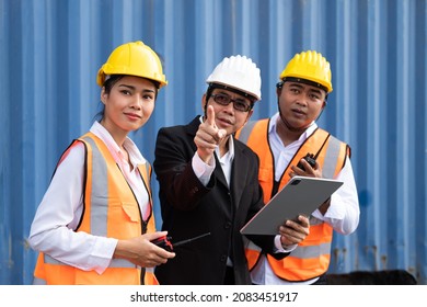 Group of logistic engineering and supervisor, using wireless tablet to see delivery information and orders while planning for container shipment. Logistic workers business.