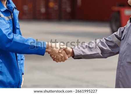 Group of logistics engineers or dock workers collaborating at a shipping container terminal, showing cooperation, teamwork, and partnership in industrial work environment.