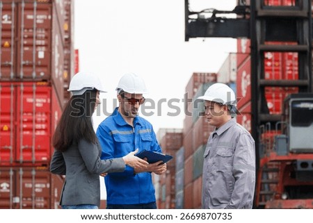 Group of logistics engineers or dock workers collaborating at a shipping container terminal, showing cooperation, teamwork, and partnership in industrial work environment.