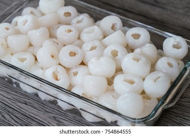 Group Of Lychee And Peeled In Glass Tupperware