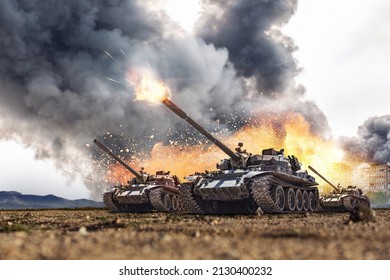 Group of main battle tanks with a city on fire on the background. One tank firing a shell from the barrel. Military or army special operation