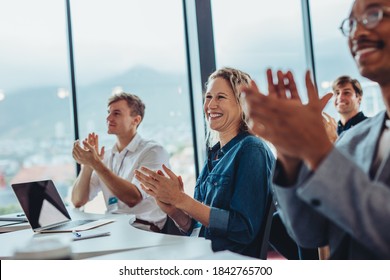 Group Of Male And Female Business Professionals Clapping Hands In Conference. Audience Applauding After Successful Seminar.