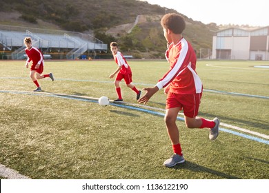 Group Of Male High School Students Playing In Soccer Team