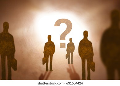 Group Of Man Standing Infront Of Qustion Mark Sign Made From Brown Paper Silhouette Style. 
