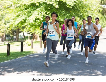 Group Of Marathon Athletes Running On Street