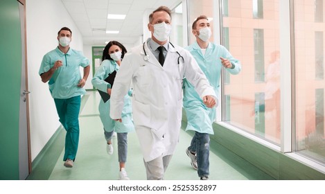 A group of masked healthcare professionals, including doctors and nurses, running urgently through a hospital hallway. Ideal for emergency response, teamwork, and medical crisis management themes. - Powered by Shutterstock