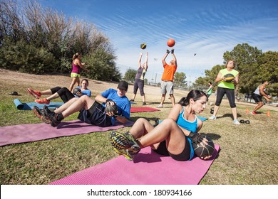 Group of mature adults working out in fitness class - Powered by Shutterstock