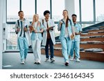 Group of medical and nursing students leaving the amphitheater after a lecture at medical university. 