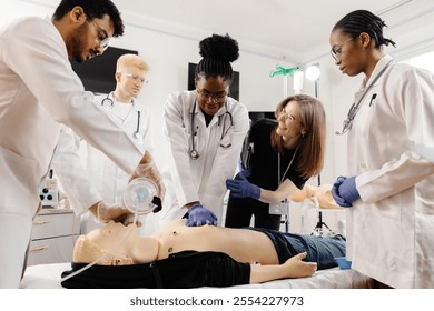 A group of medical personnel is gathered around a CPR training dummy, practicing life-saving techniques in a medical simulation setting. - Powered by Shutterstock