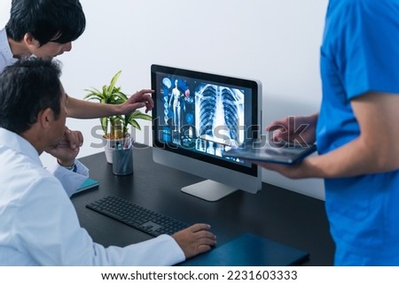 A group of medical staff having a meeting while looking at a PC screen.　Teamwork of business.