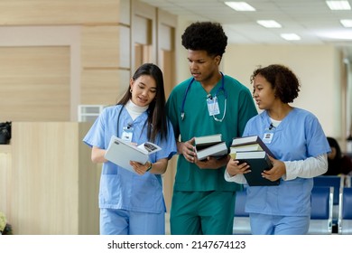 group of medical student holding book walking and talking in university. education and learning medical concept.