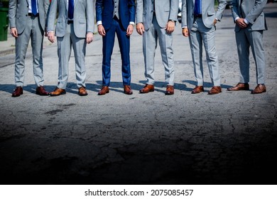 A Group Of Men In Suits With Dress Pants And Brown Dress Shoes