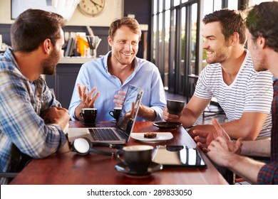Group Of Men Talking At A Coffee Shop
