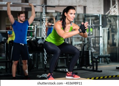 Group Of Men And Woman In Functional Training Gym Doing Fitness Exercise