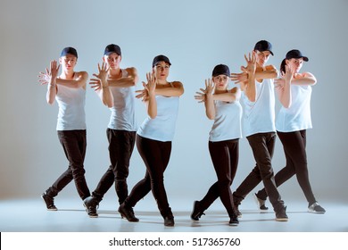 Group Of Men And Women Dancing Hip Hop Choreography