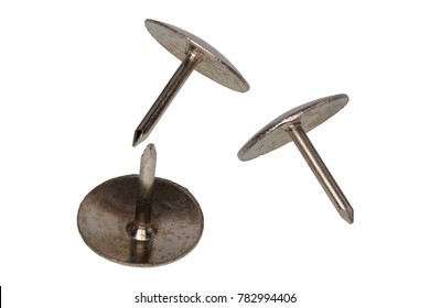 Group Of Metal Thumb Tacks Isolated On A White Background